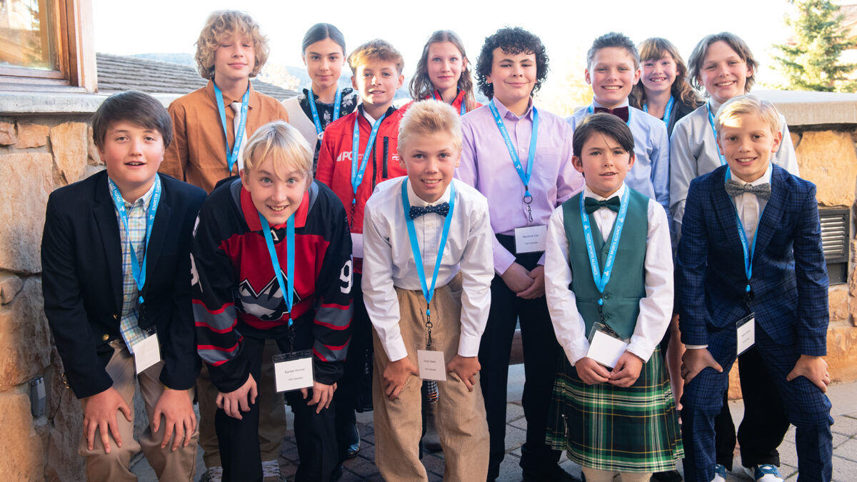 Youth Sports Alliance athletes pose for a photo in between escorting guests in to the Jan's Winter Welcome Fundraiser.