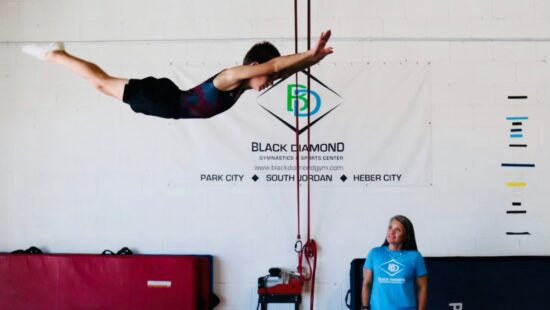 Charlie Davis flies through the air during a training session at Black Diamond Gymnastics.