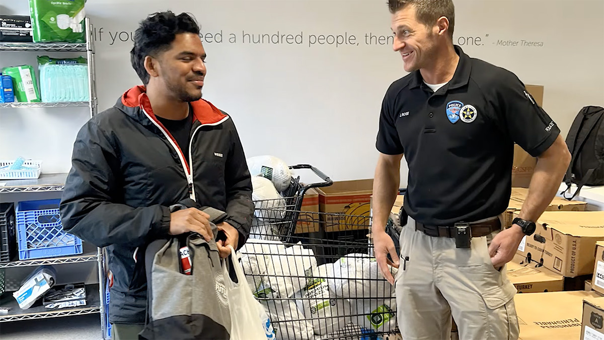 Jason Rose of the Park City Police Department helps deliver 1,800 turkeys at the Christian Center of Park City.