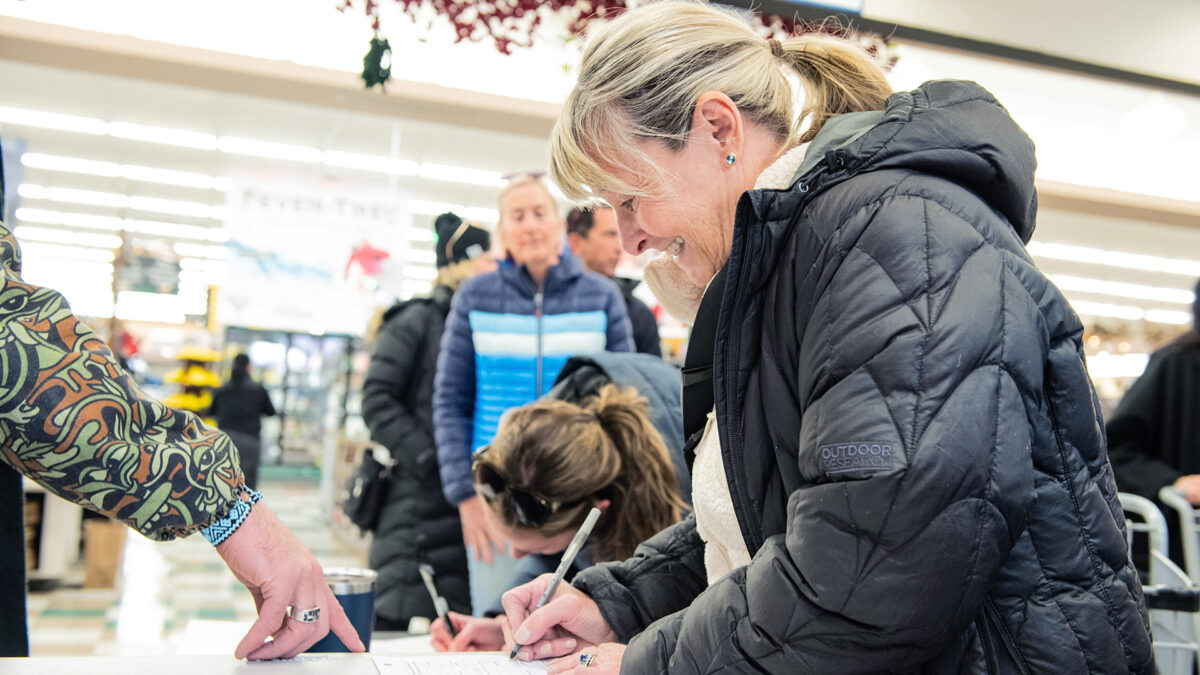 Summit County residents sign the Dakota Pacific referendum at The Market in Park City.