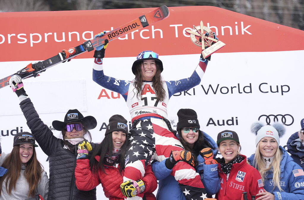 The winner United States' Lauren Macuga celebrates with the team after an alpine ski, women's World Cup super G race, in St. Anton, Austria, Sunday, Jan. 12, 2025.