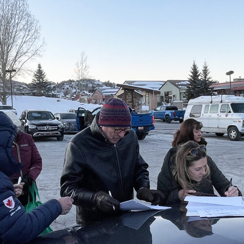 Summit County residents sign the referendum petition outside Macey's Market in Pinebrook.