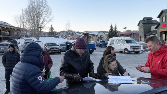 Summit County residents sign the referendum petition outside Macey's Market in Pinebrook.