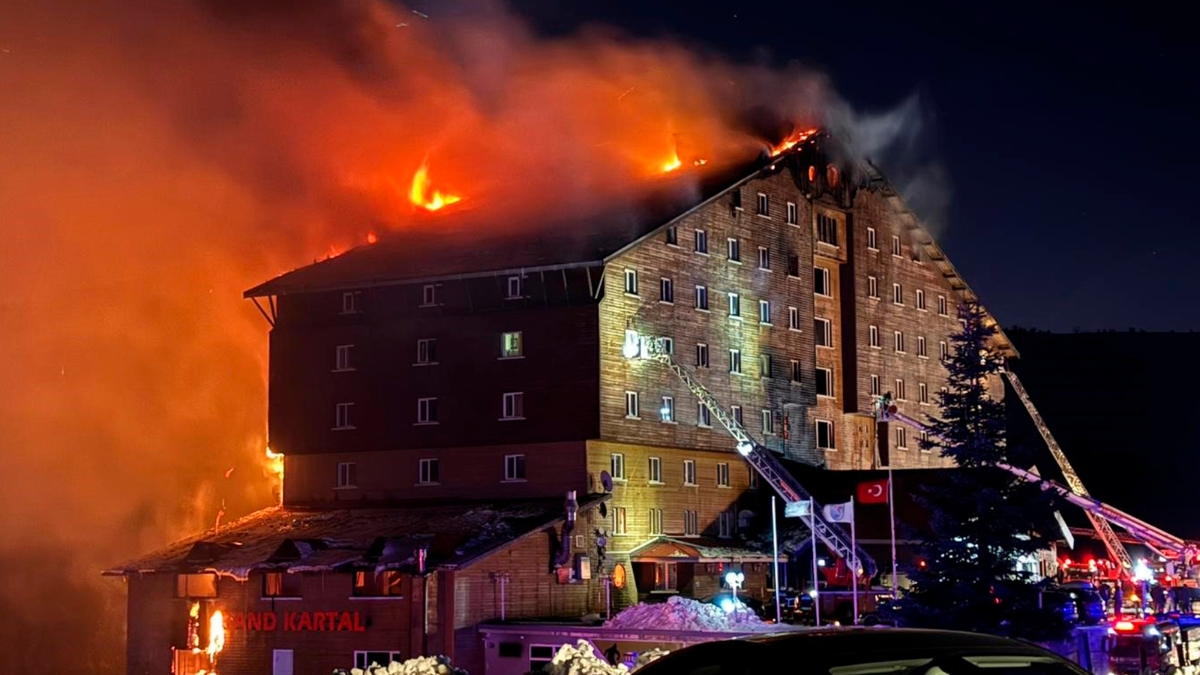 Firefighters work to extinguish a fire in a hotel at a ski resort of Kartalkaya in Bolu province, in northwest Turkey, Tuesday, Jan. 21, 2025.