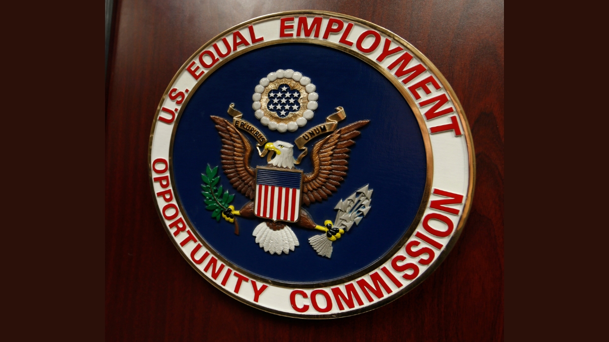 FILE - The emblem of the U.S. Equal Employment Opportunity Commission (EEOC) is shown on a podium in Vail, Colorado, Feb. 16, 2016, in Denver.