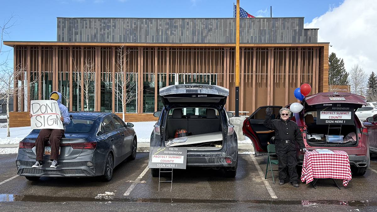 A representative from Wasatch Back Future and a volunteer for Protect Summit County at the Kamas Library parking lot during a signature gathering event held Feb. 15.