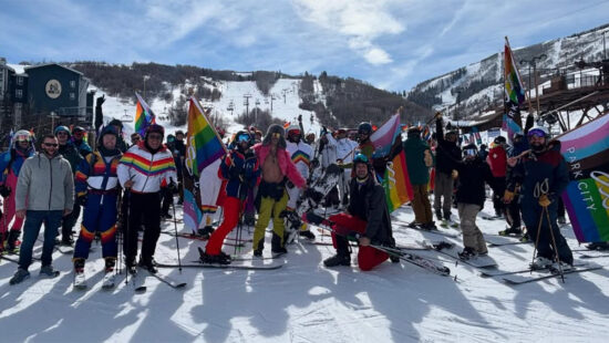 A colorfully clad group of riders convene at OPark City Mountain Resort for a group photo on Feb. 22, 2025. Summit Pride Day