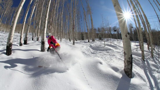 A skier enjoys fresh powder in Aspens at Powderhorn Mountain Resort.