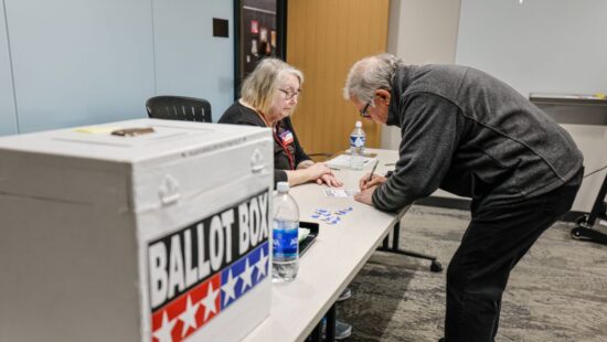 A voter casts a ballot during early voting in Waukesha, Wis., Tuesday, March 18, 2025.