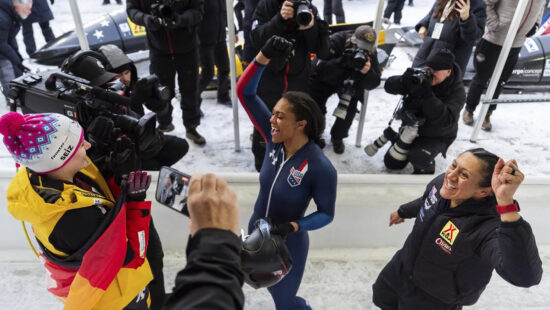 Kaysha Love, center, celebrates with Laura Nolte, left, and Elana Meyers Taylor, right, after winning first place in the women's monobob at the bobsledding world championships, Sunday, March 9, 2025.