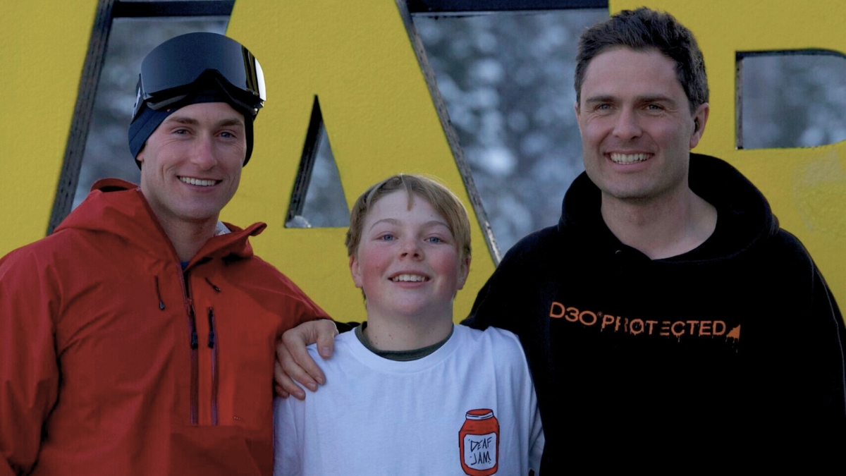 Olympian Aaron Small, 13-year-old Emmett Haaland, and professional freestyle skier Robin Gillon celebrate a successful day on the slopes at Woodward Park City as part of the Hear My Life Ambassador Relay, fostering mentorship and representation for athletes with hearing loss.