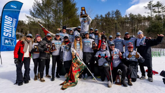 The University of Utah ski team hoist the championship trophy at the Dartmouth Skiway on March 8 after winning the title for the 17th time.