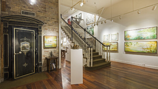 A historic bank vault anchors the interior of Meyer Gallery in Park City, Utah, blending 19th-century architecture with contemporary fine art in celebration of its 60th anniversary.