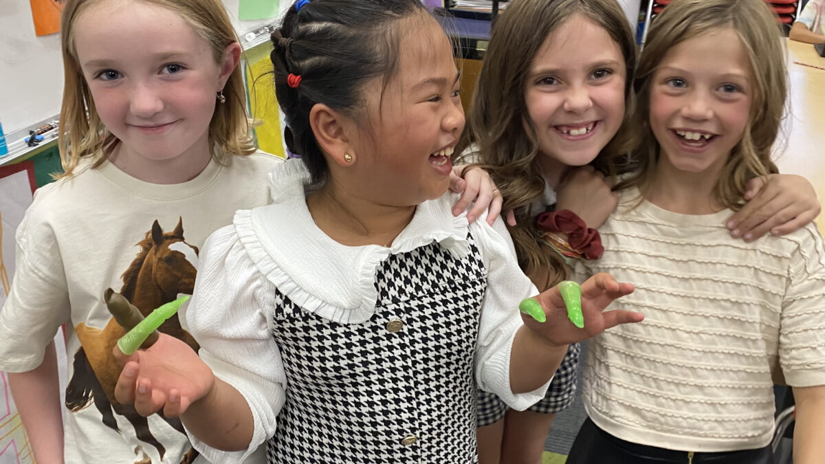 Weilenmann School of Discovery students light up with laughter during a classroom experiment, celebrating curiosity, creativity, and connection in a vibrant learning environment.