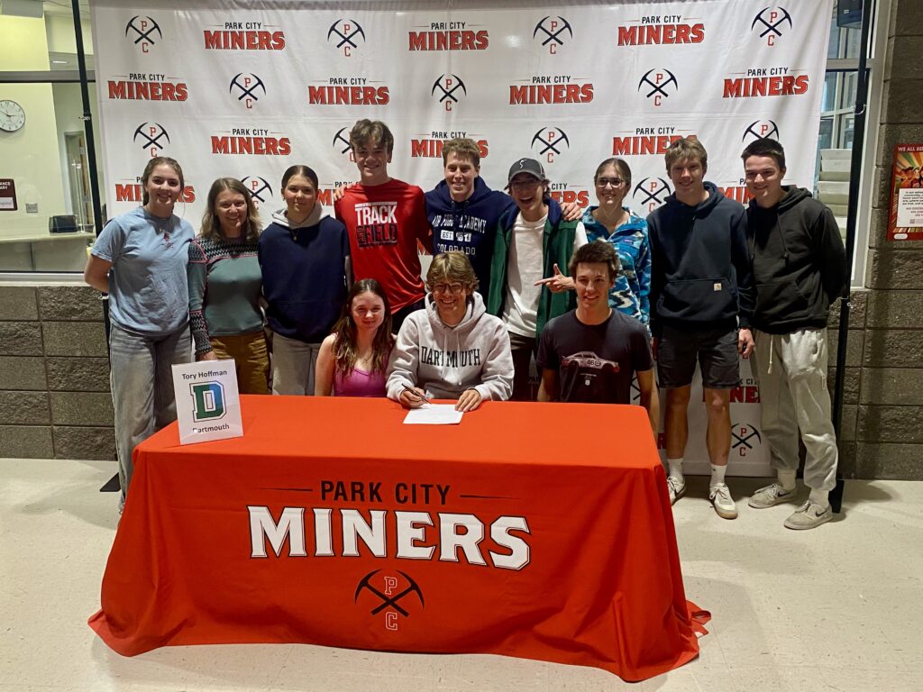 Senior Tory Hoffman, surrounded by his classmates and teammates signs to XC ski for D1 Dartmouth.