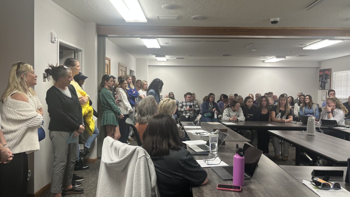 Parents, students, and supporters pack a Park City School District board meeting to advocate for the retention of cheer and dance coach Melanie Hiatt and protest proposed changes to the programs that they say threaten their future.