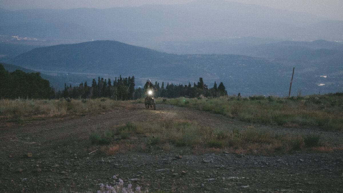 Tomás Parra-Gómez climbs King Road before dawn, headlamp piercing the haze during his 34-hour Everest-height ride in Park City, July 31, 2024.