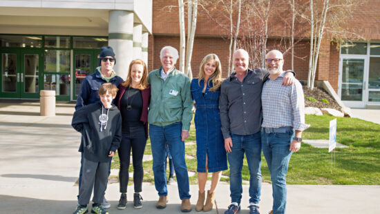 Members of the Doilney and Louis families pause outside a Park City school after surprising educators with the 2025 Excellent Educator Awards on April 25.
