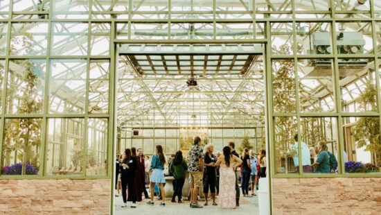 Writers will gather in the greenhouse at Park City Gardens during Understory’s welcome reception, framed by summer light and mountain greenery.