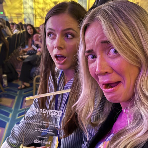 Aimee Colton (left), UDOT social media manager, and Elizabeth McMillan, UDOT director of communications, pose for a selfie while holding the Golden Post Award for 2025 best social media team during the Government Social Media conference in Orlando, Florida on May 21, 2025.