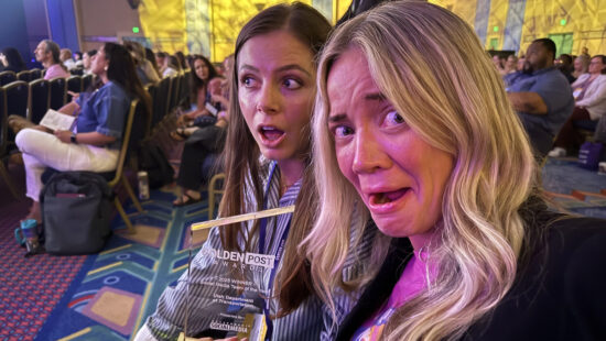 Aimee Colton (left), UDOT social media manager, and Elizabeth McMillan, UDOT director of communications, pose for a selfie while holding the Golden Post Award for 2025 best social media team during the Government Social Media conference in Orlando, Florida on May 21, 2025.
