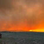 The France Canyon Fire turns the sky bright orange on June 21, 2025.