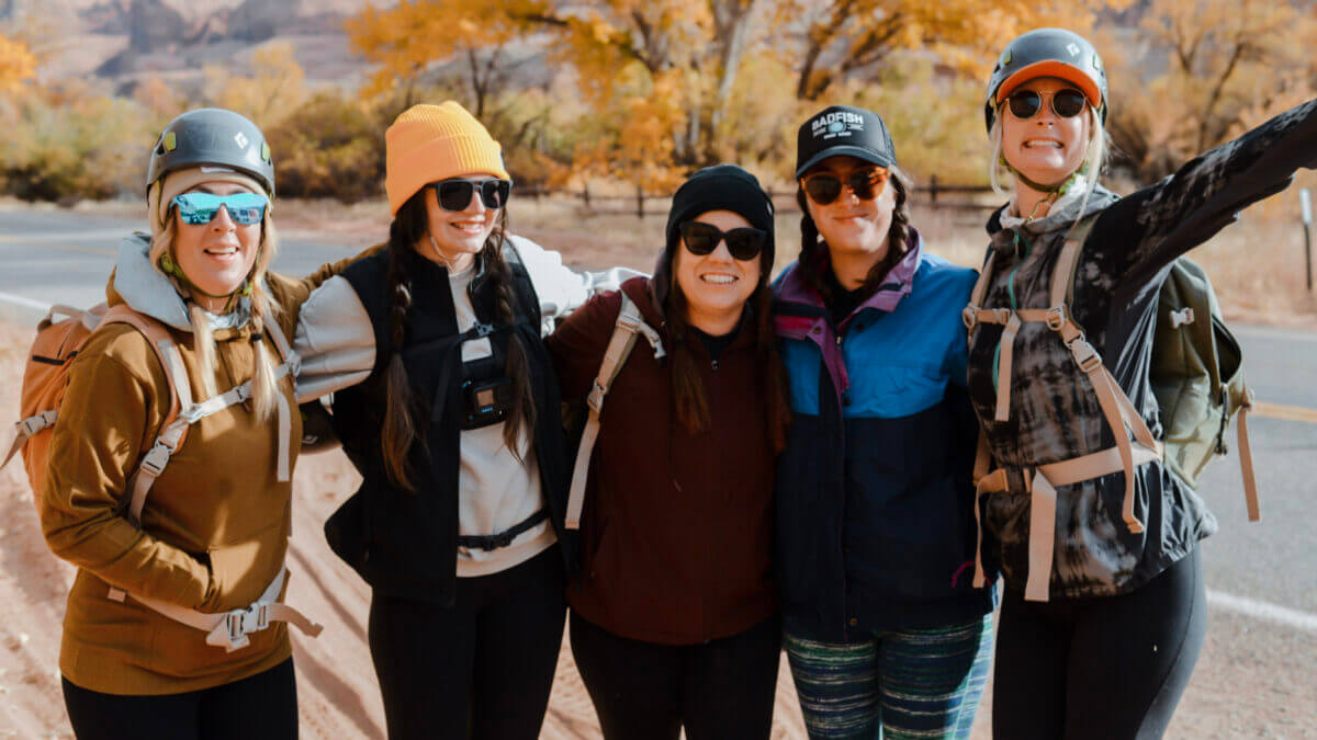 Participants in an ILLA Adventures outing pose for a photo during a fall excursion, where connection and camaraderie are as central as the thrill of the outdoors.