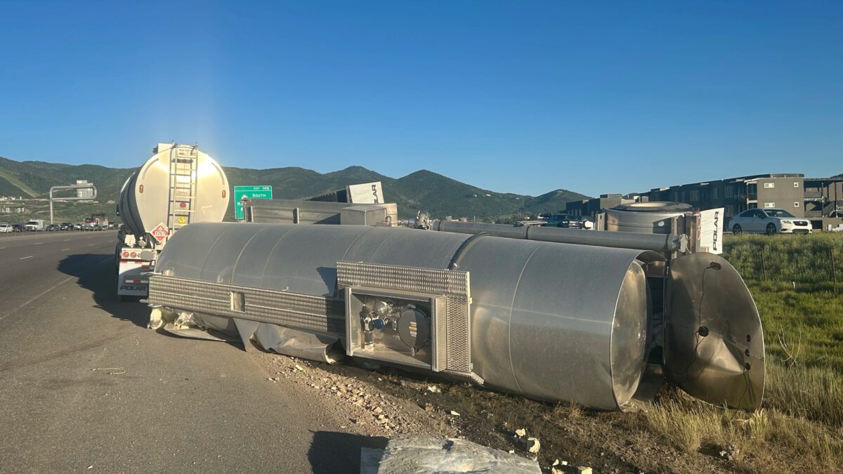 The incident occurred when a semi-tanker truck pulling a pup trailer loaded with oil struck an elk near milepost 146 on I-80. The impact caused the pup trailer to overturn onto another car.