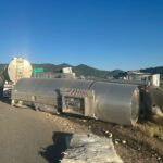 The incident occurred when a semi-tanker truck pulling a pup trailer loaded with oil struck an elk near milepost 146 on I-80. The impact caused the pup trailer to overturn onto another car.