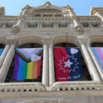Flags adopted as official banners of Salt Lake City, circumventing the state’s ban on most flags being displayed at government buildings and schools, hang outside the Salt Lake City and County building on Wednesday, May 7, 2025. The official city flags include the Salt Lake City flag, pride flag, Juneteenth flag and transgender flag.