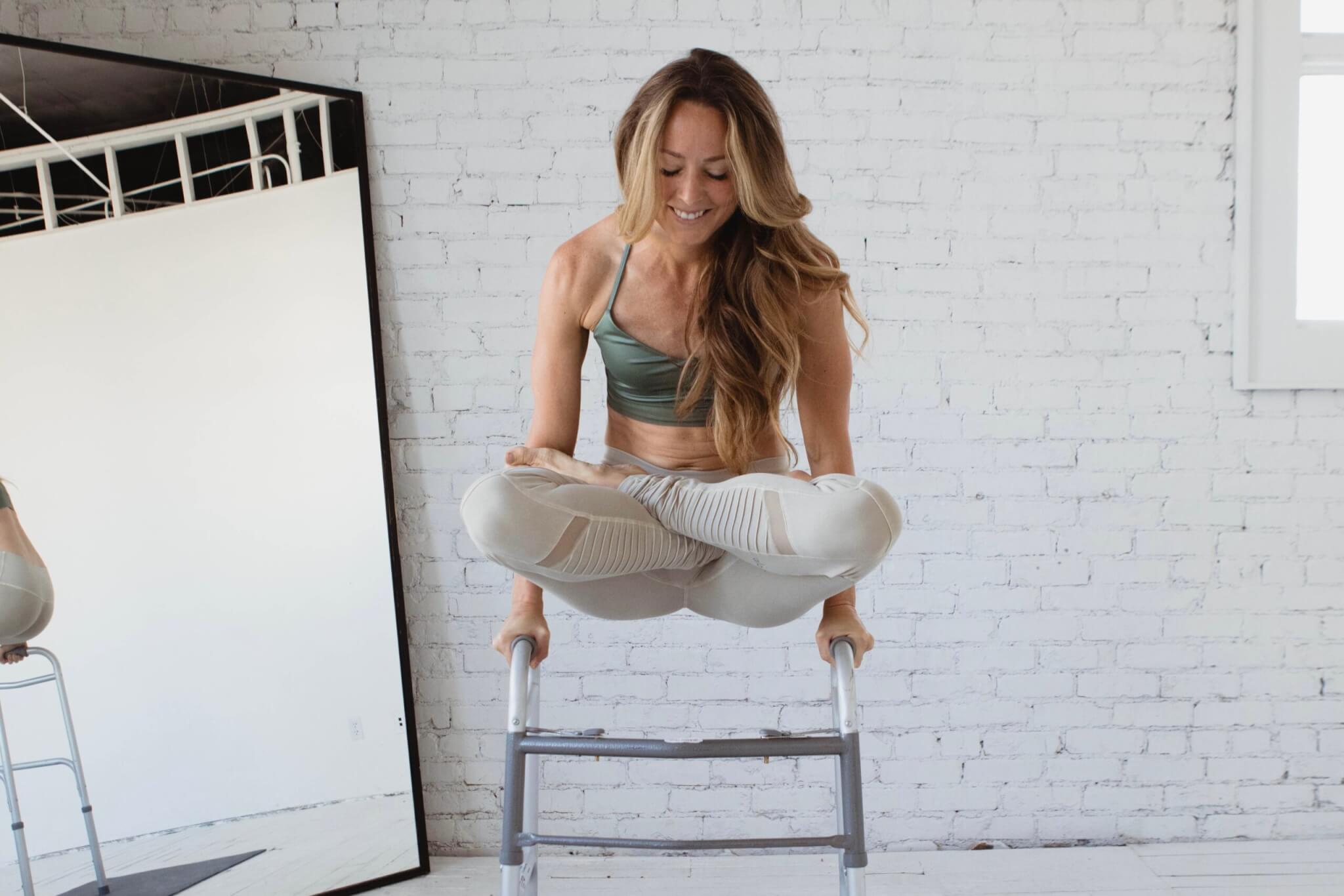 Abigail Atkinson balances in lotus atop the walker she was sent home with after her 2012 stroke. “This one is special because that is the walker I was sent home with. I’m having a celebratory moment here doing a little yoga on it, just to enjoy how far I’ve come,” she said.