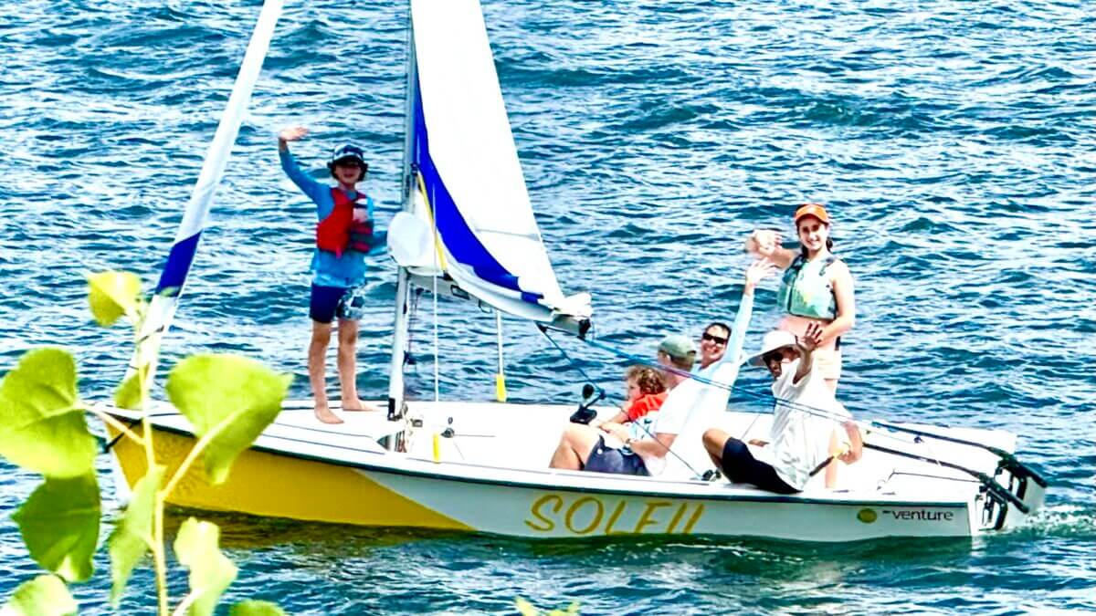 The Reucassel Family on Jordanelle Reservoir on Saturday on a family sail, the same day the boat, the "Soliel" named for their daughter, was donated from California to Sail Park City.