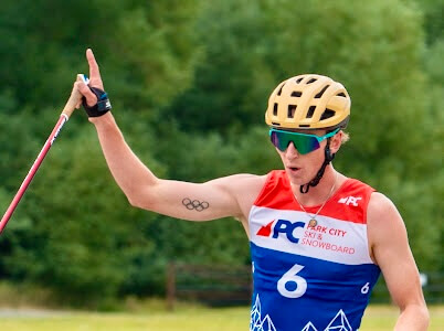 Stephen Schumann crossing the nordic combined roller ski finish line first at Soldier Hollow for the Springer Tournee.