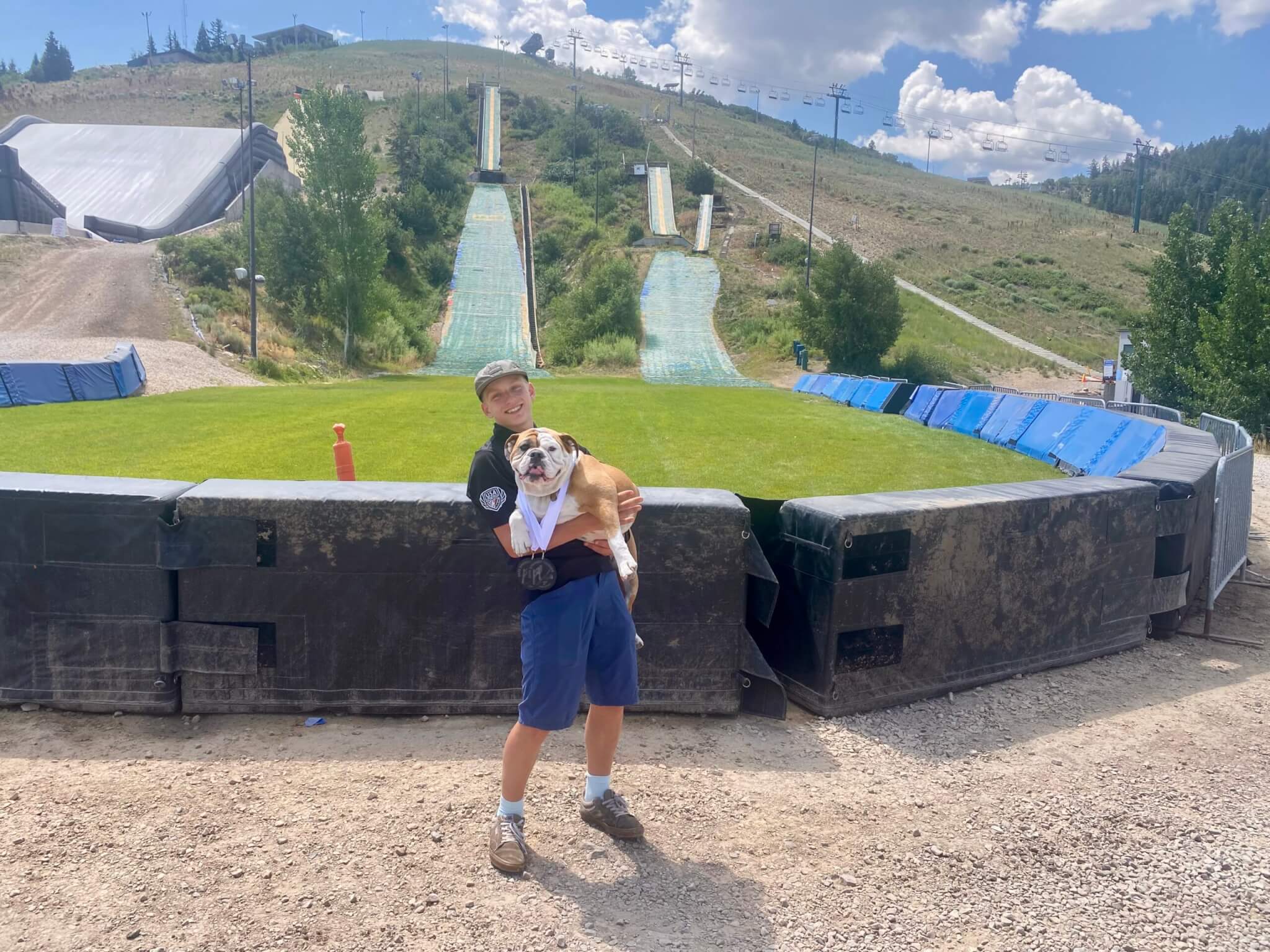Miles Warnke from Stemboat Springs with his dog Frankie wearing his two medals won at Springer Tournee, Miles also won the Target Jump.