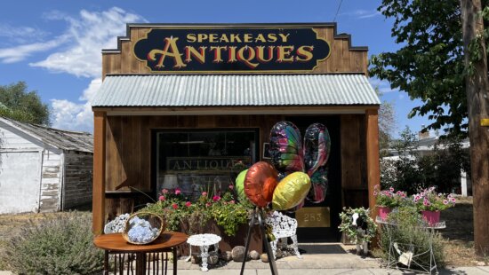 Speakeasy Antiques, a restored former shoe‑repair shop owned by Marilee Ward, stands along Main Street in Kamas, Utah, offering what Ward says is Summit County’s only dedicated antique store.