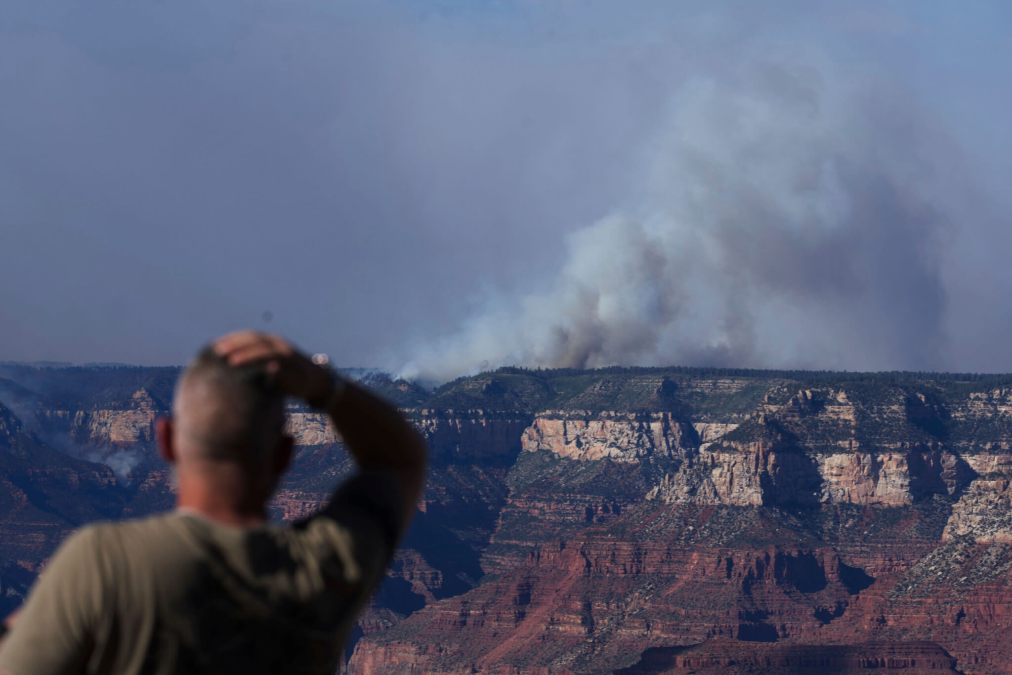 Smoke rises from the Dragon Bravo Fire at the Grand Canyon as seen from Mather Point near Grand Canyon Village, Ariz., Monday, July 28, 2025.