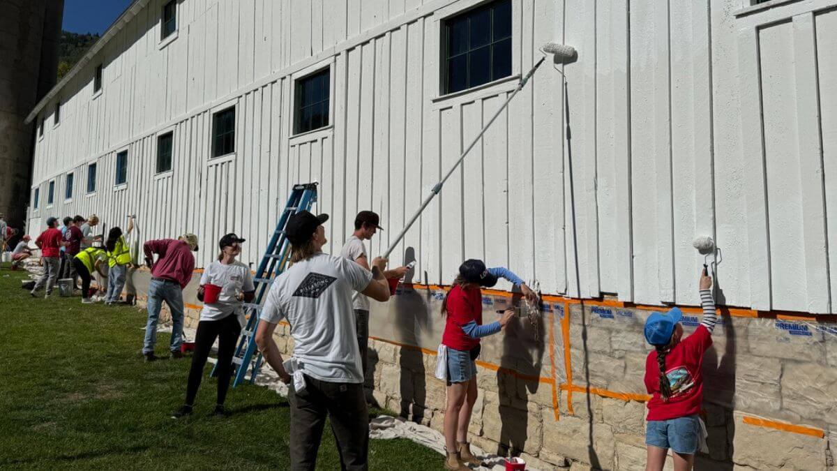 Volunteers help paint the McPolin Barn at Park City's Day of Service 2024.
