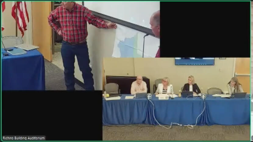 The District Commission discusses a new map presented at Monday's meeting.
