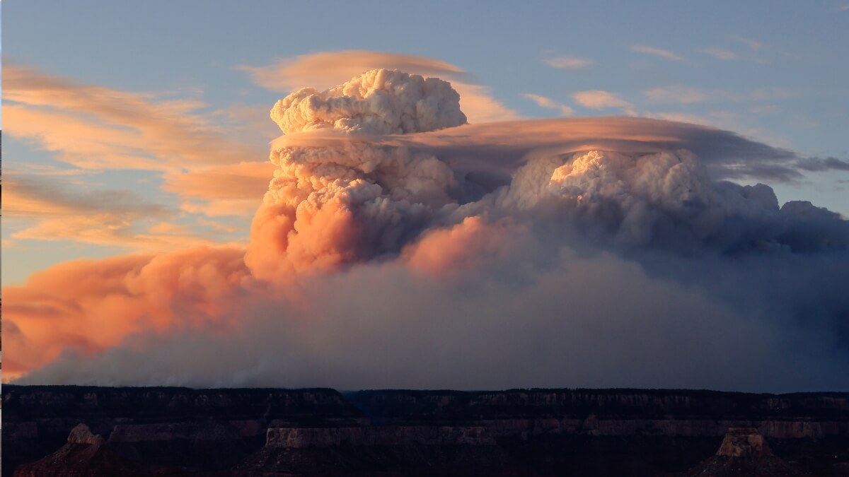 In this photo, 'fire clouds' form near the Bright Angel Trailhead at the South Rim in the Grand Canyon, Ariz., Sunday, July 27, 2025.