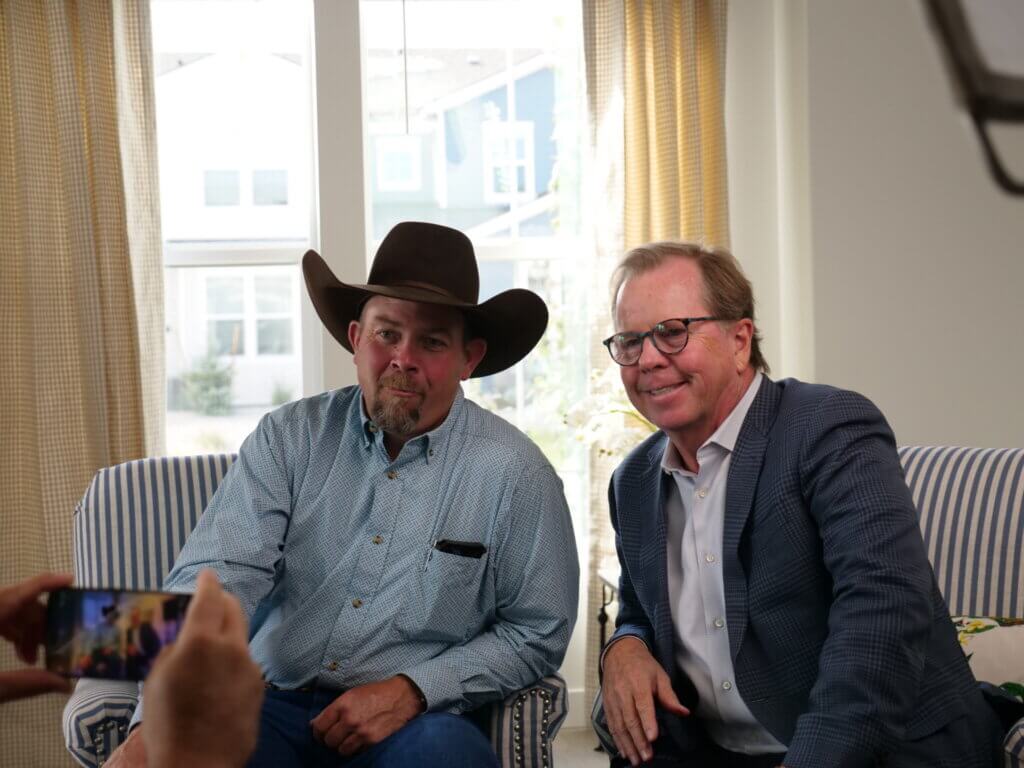 Francis Mayor Jeremie Forman (left) and Ivory Homes CEO Clark Ivory pose for a photo during a ribbon cutting ceremony for a new housing development in Francis, Utah on Sept. 16, 2025. 