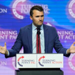 Turning Point USA Founder Charlie Kirk speaks during a campaign rally, Oct. 24, 2024, in Las Vegas.