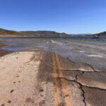 Where pavement meets water—this was once the main road to Keetley, now submerged beneath Jordanelle Reservoir.