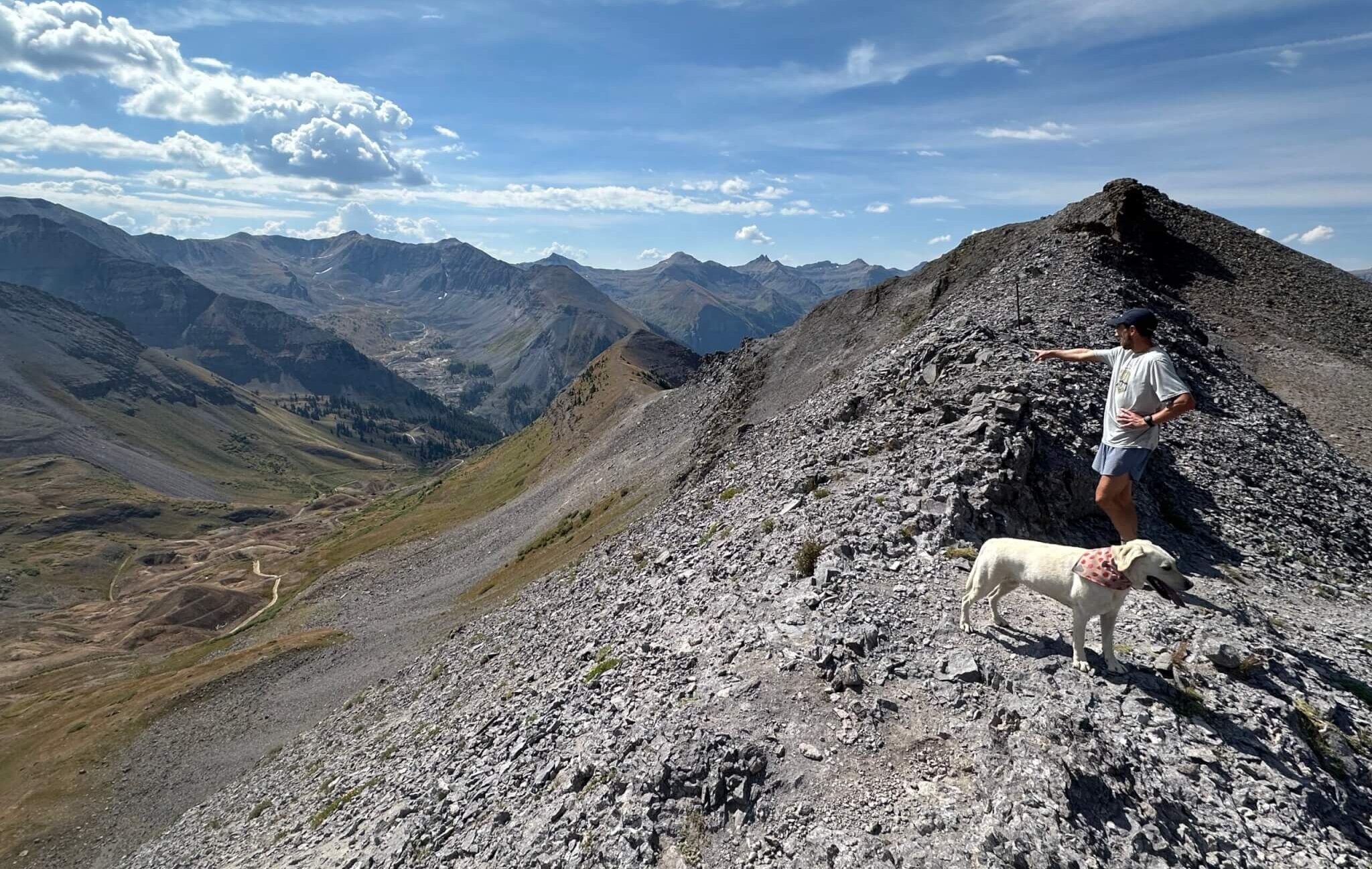 Telluride, CO. A friend of Adam Loomis and his dog scouting the trail with Loomis.