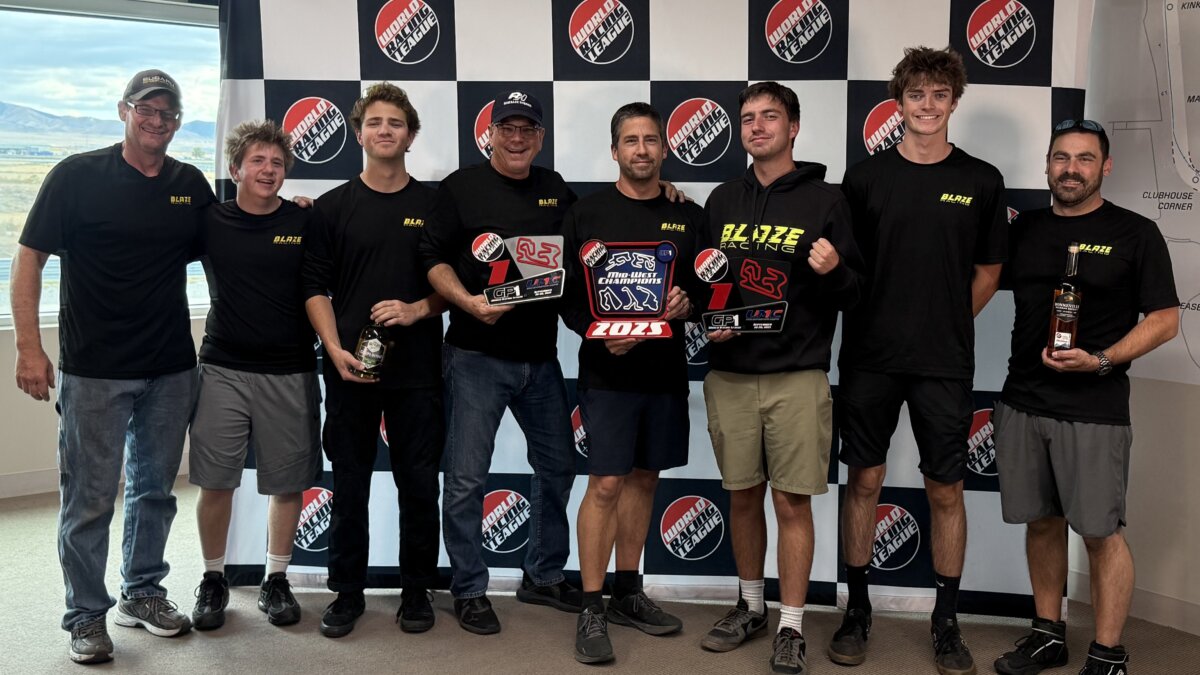 Holding the championship trophies from both Saturday and Sundays race. From left to right Mike Tilton (lead mechanic), Alec Lebwohl, William Perret, Scott Mann, Jason Lebwohl, Zachary Lebwohl, Lincoln Larson, Robert Lebwohl