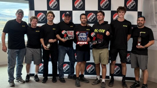 Holding the championship trophies from both Saturday and Sundays race. From left to right Mike Tilton (lead mechanic), Alec Lebwohl, William Perret, Scott Mann, Jason Lebwohl, Zachary Lebwohl, Lincoln Larson, Robert Lebwohl