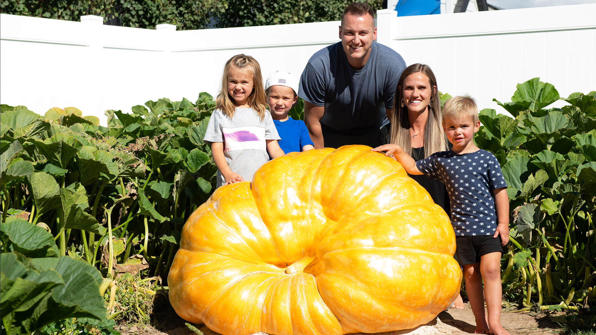 The Mason family beside their 800-pound pumpkin.