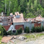 Damage to the exterior shaft room and hoist house at the Thaynes Mine site.