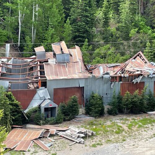 Damage to the exterior shaft room and hoist house at the Thaynes Mine site.