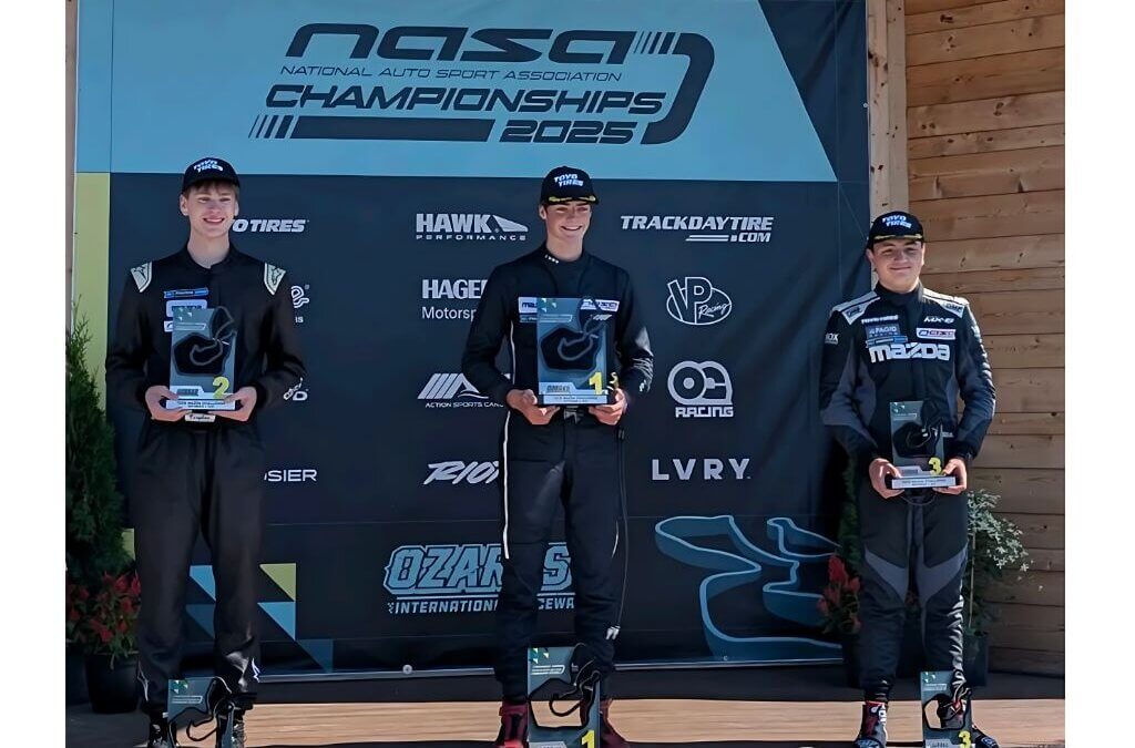 Lincoln Larson of Park City (center) celebrates his Spec Miata national title at the 2025 NASA Championships at Ozarks International Raceway.
