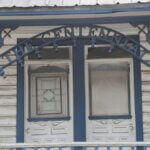 "The Centennial" sign on the Centennial House on Main Street.
